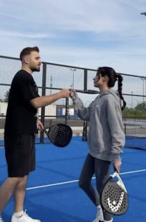Players sharing a drink after playing padel